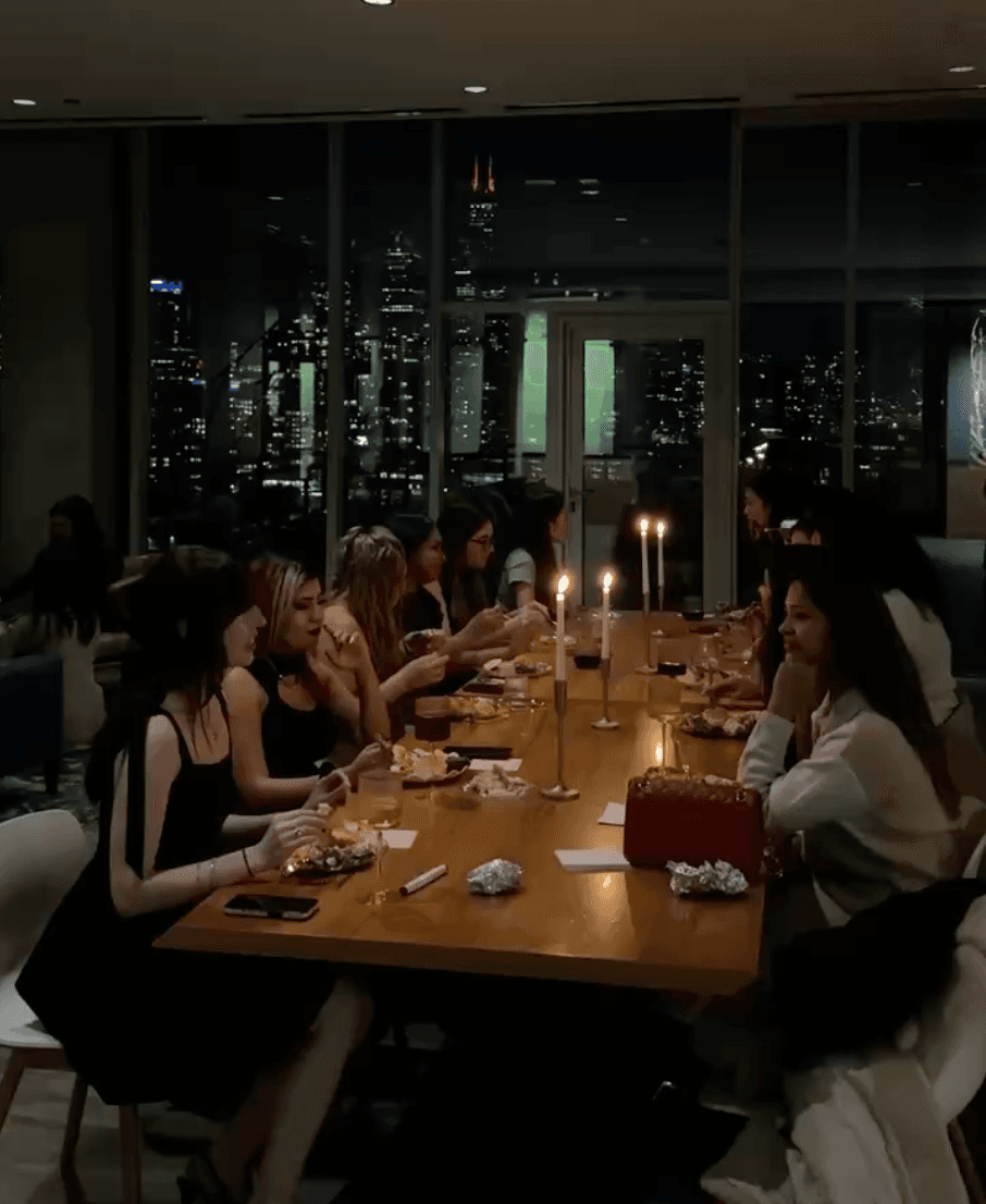 Intimate dinner with friends and the Chicago skyline at night